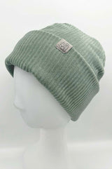 Nahaufnahme des weichen Cordstoffs in gedecktem Grün mit angenehmer Struktur